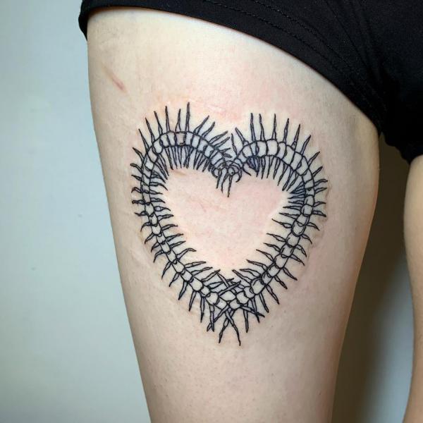 Heart Centipede tattoo thigh