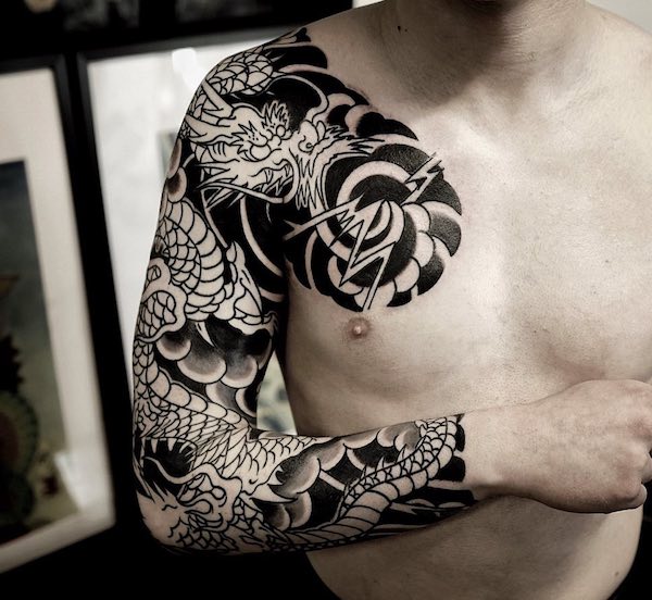 Japanese sleeve and chest dragon tattoo
