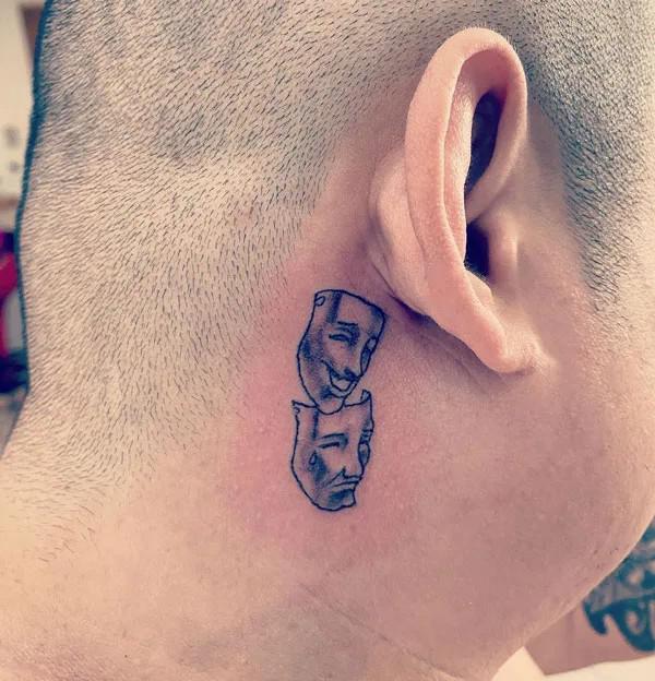 Laugh now cry later tattoo behind ear