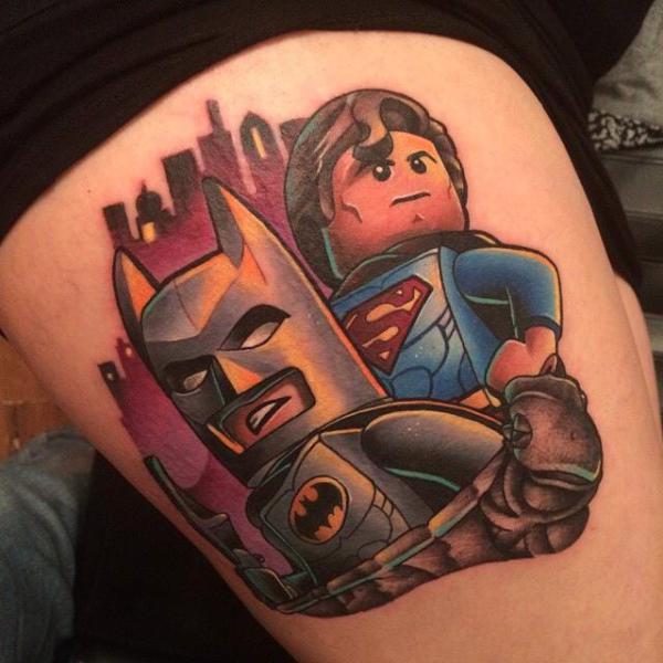 Lego and batman tattoo thigh