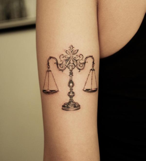 Libra scales tricep tattoo