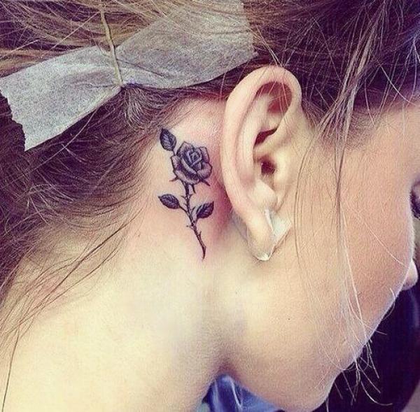 Light purple rose tattoo behind ear
