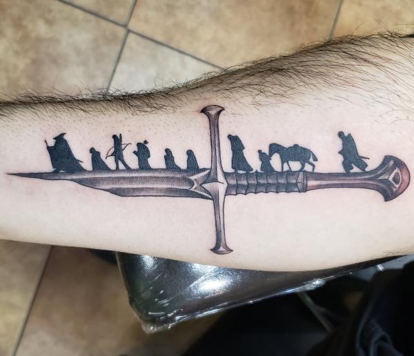 Lord of the rings sword tattoo forearm