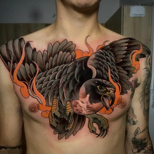 Neo traditional firing falcon chest tattoo