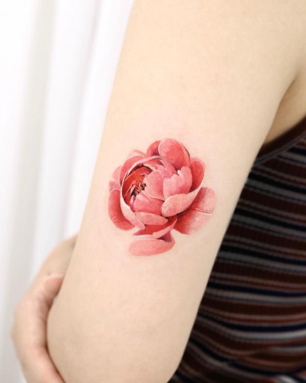 Pink peony tricep tattoo