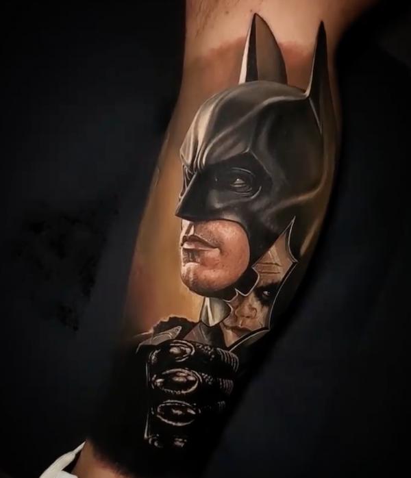 Realistic Batman calf tattoo