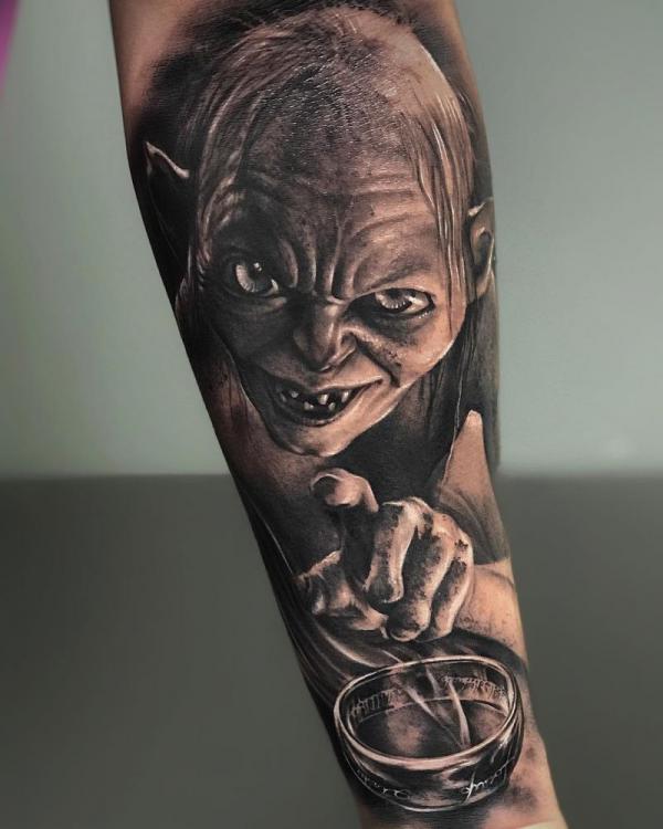 Realistic Gollum and One Ring tattoo forearm