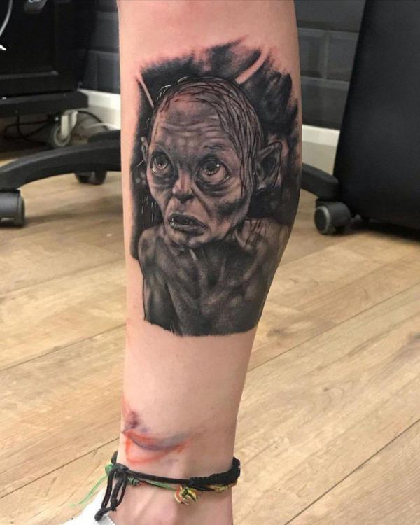 Realistic Gollum tattoo on lower leg