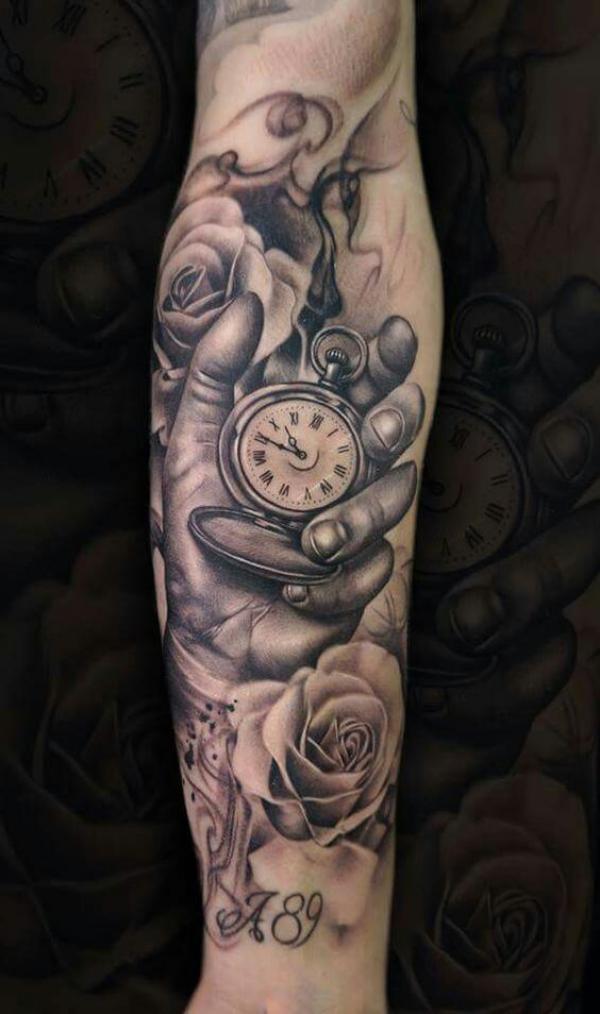 Realistic hand holding pocket watch with roses tattoo forearm