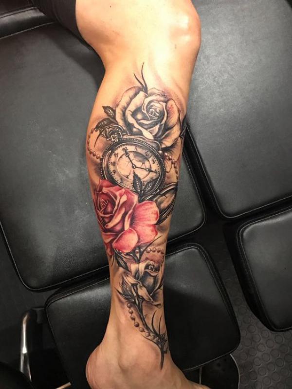 Red and grey rose and pocket watch tattoo lower leg