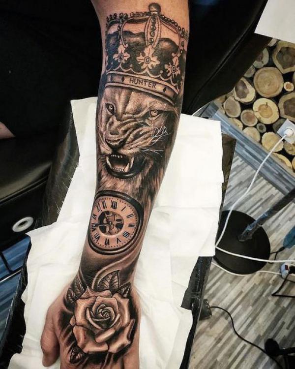 Rose and clock lion king tattoo