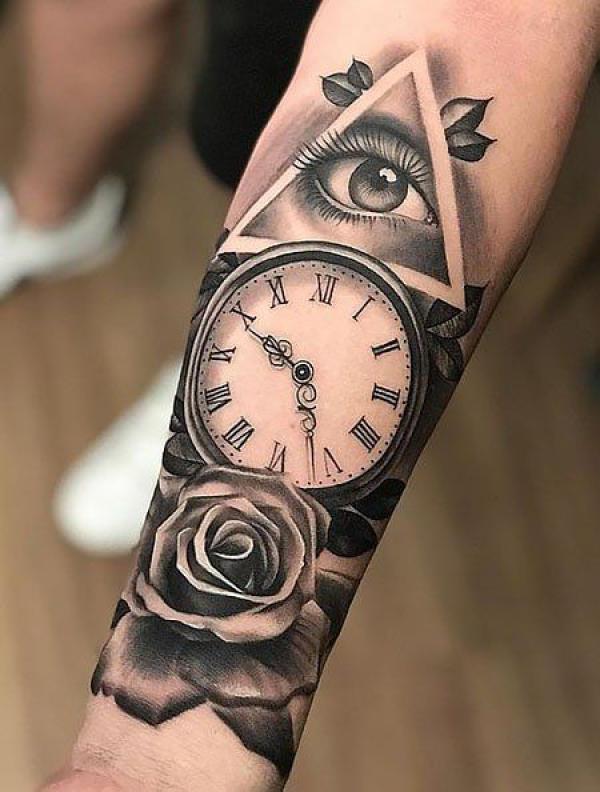 Rose and clock with all seeing eye tattoo forearm