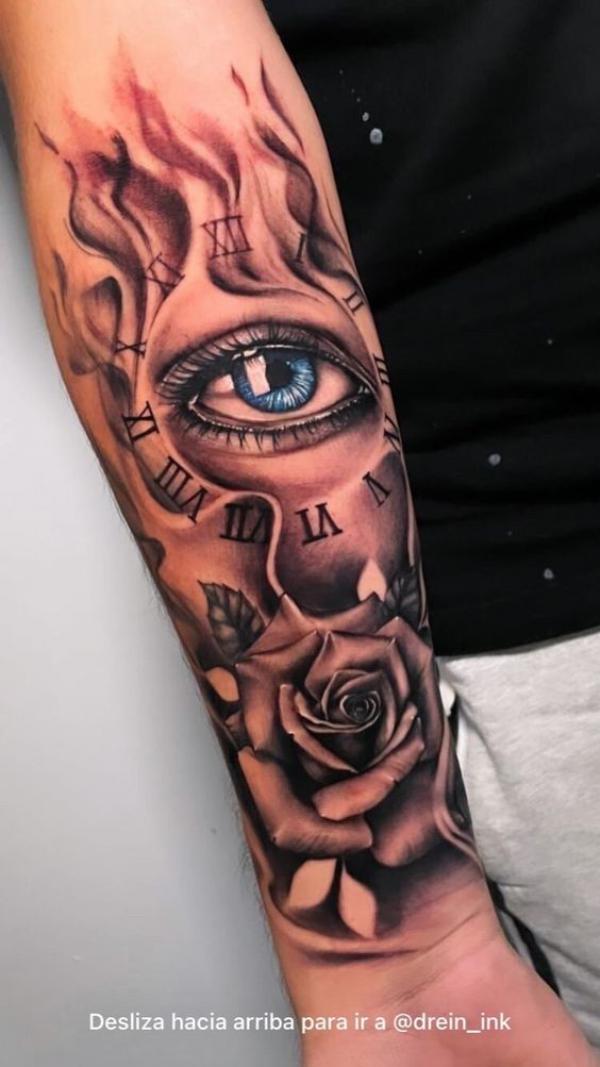 Rose and clock with eye and flame tattoo forearm