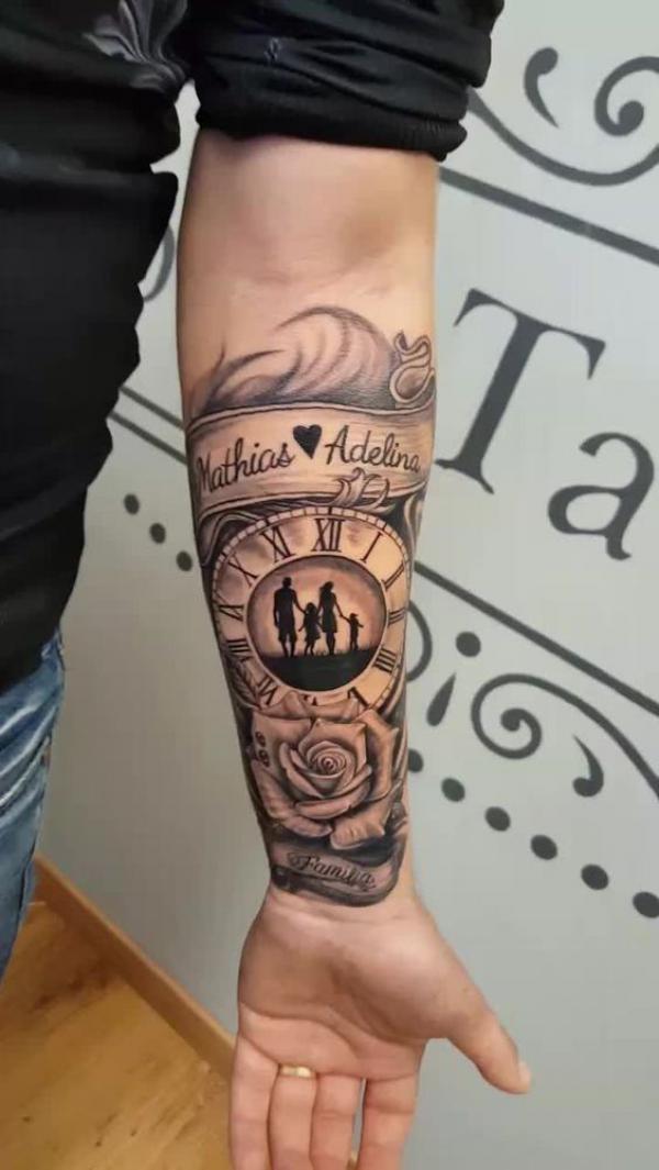 Rose and clock with family names tattoo forearm