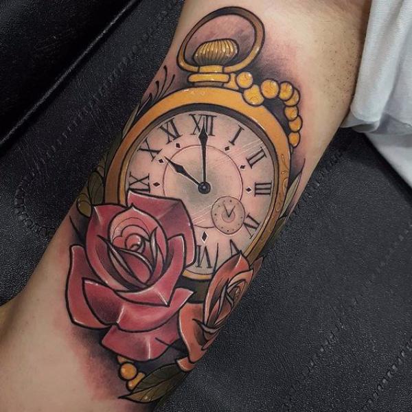 Rose and pocket watch bicep tattoo