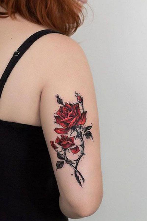 Rose with thorns tricep tattoo