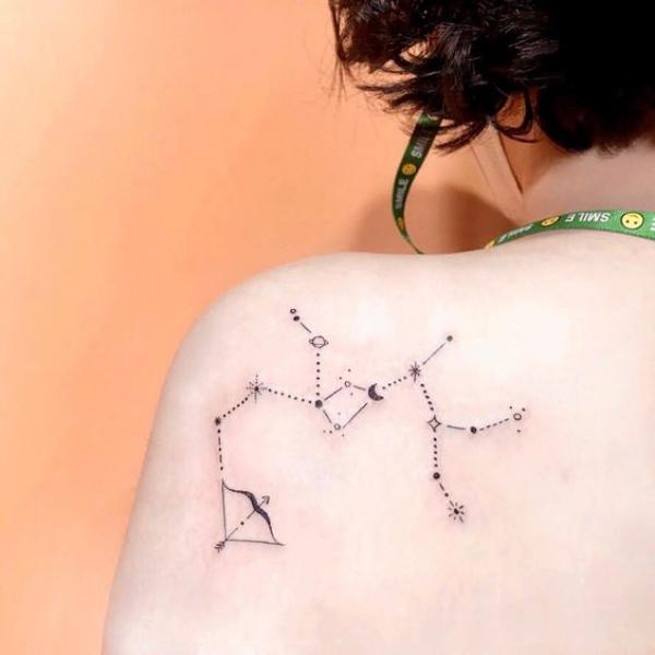 Sagittarius constellation shoulder blade tattoo