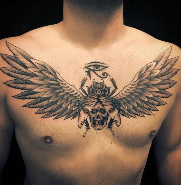 Scarab with skull face and Eye of Horus chest tattoo