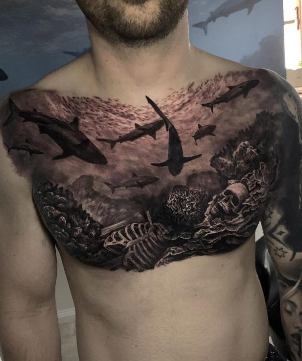 Sharks and skeleton tattoo on chest