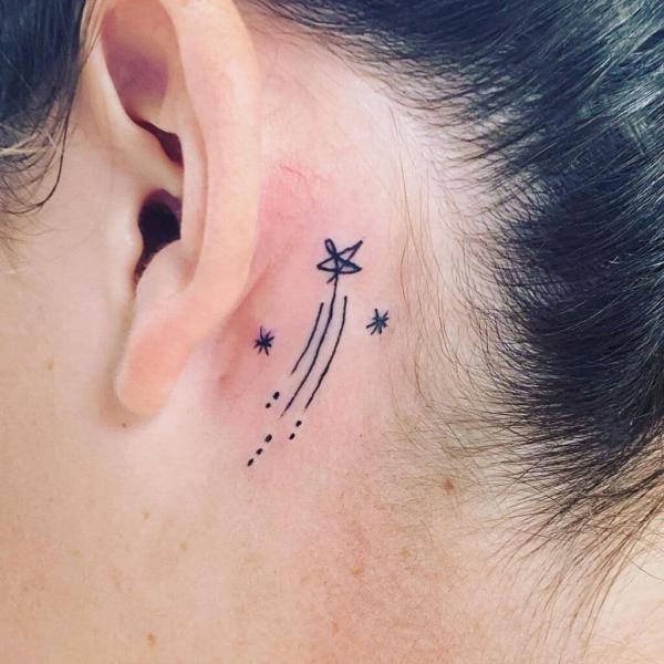 Shooting Star tattoo behind the ear