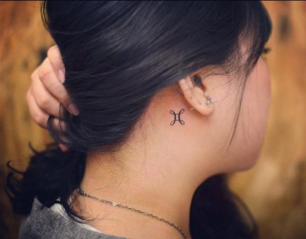 Small Gemini glyph tattoo behind ear