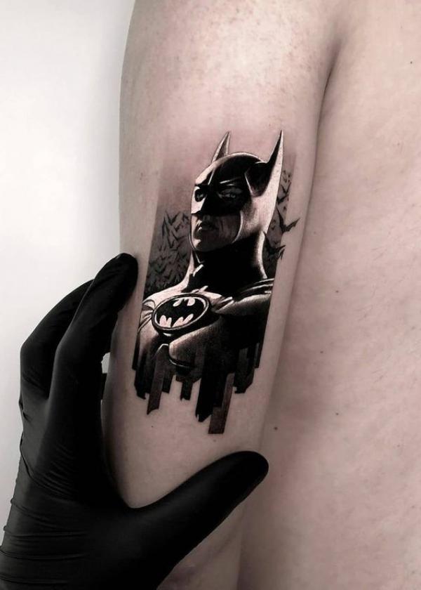 Small batman back of arm tattoo