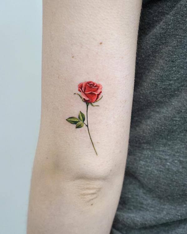 Small rose tricep tattoo