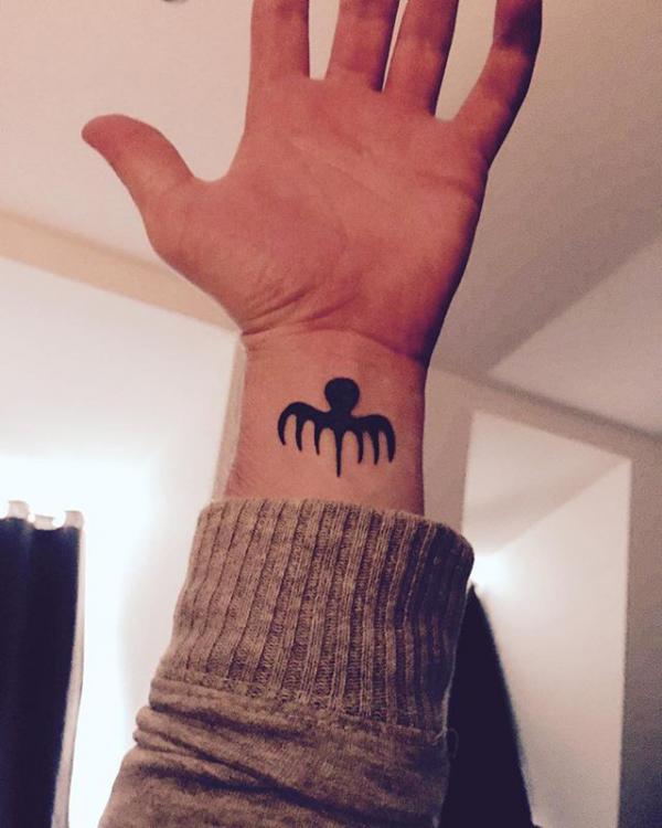 Spectre tattoo wrist