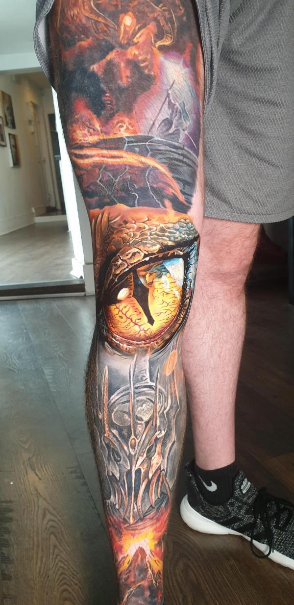 The Eye Of Smaug Lord of the Rings leg sleeve tattoo