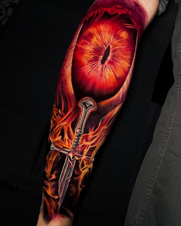 The Eye of Sauron and sword tattoo