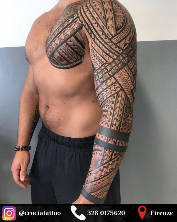 Tribal chest to full sleeve tattoo