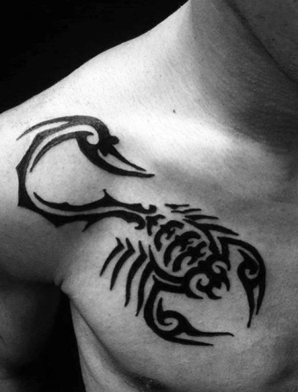 Tribal scorpion chest tattoo