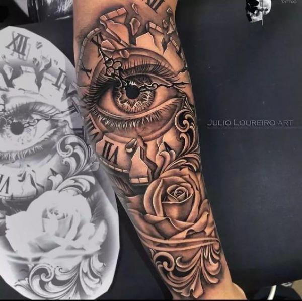 Vintage rose and broken clock with eye tattoo arm