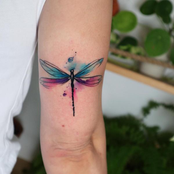 Watercolor dragonfly tricep tattoo