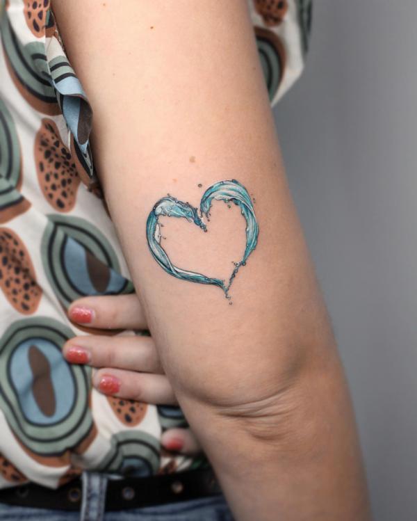 Wave heart tricep tattoo