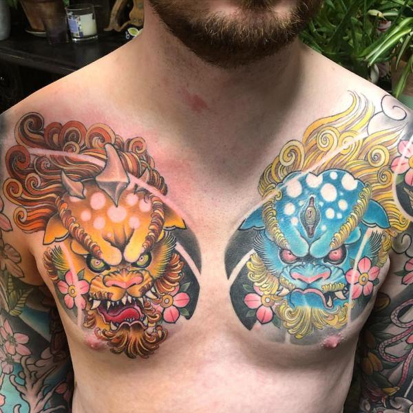 Yellow and blue foo dog chest tattoo