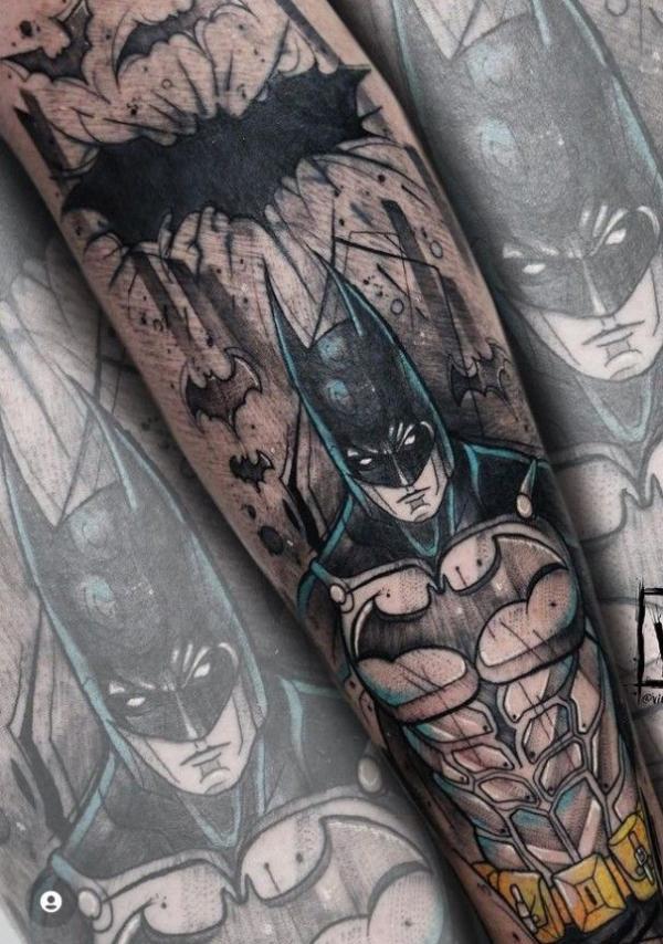batman and bat tattoo arm