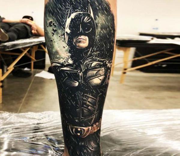 batman in rain tattoo forearm