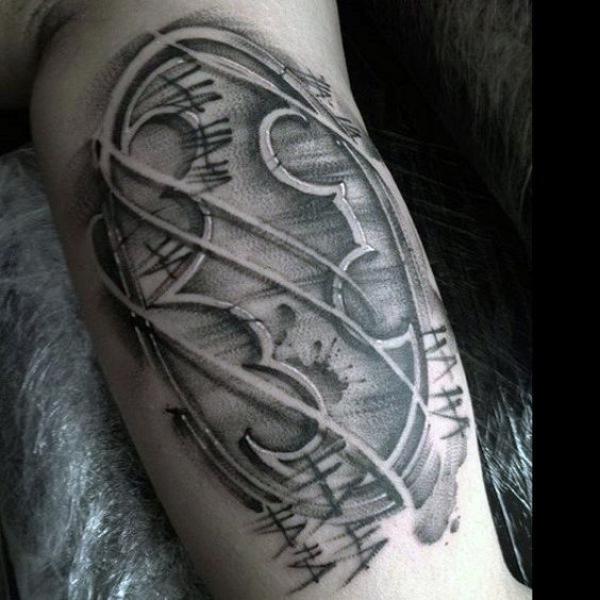 batman logo tattoo bicep