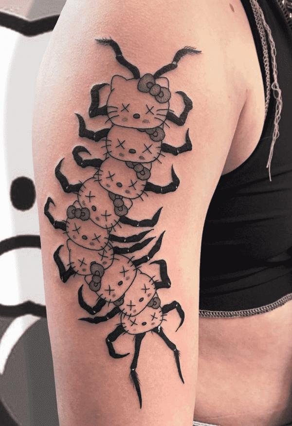 hello kitty centipede tattoo arm
