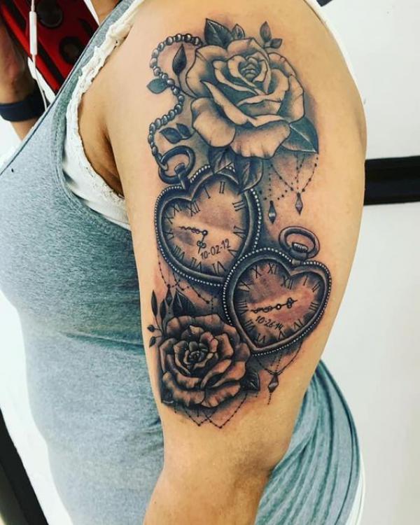 rose and heart pocket watch tattoo on upper arm