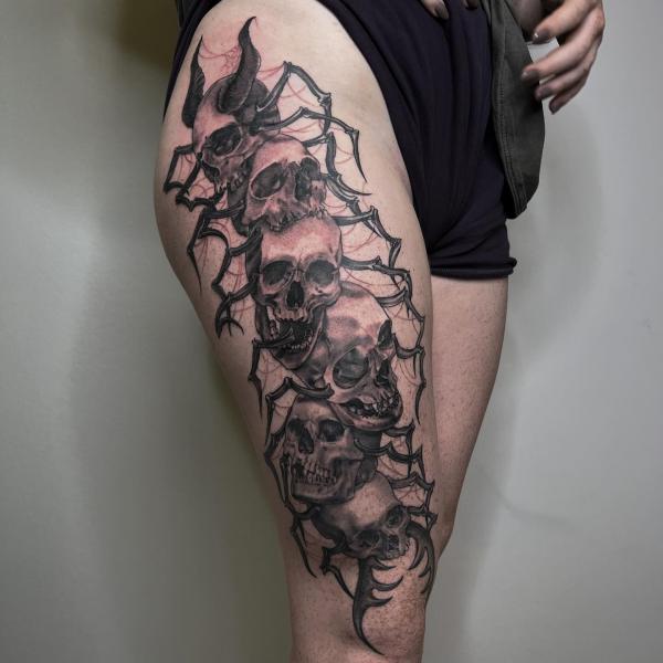 traditional centipede tattoo side thigh